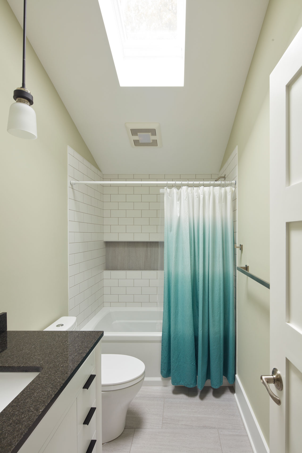 Large Skylight With Subway Tile In Bathroom
